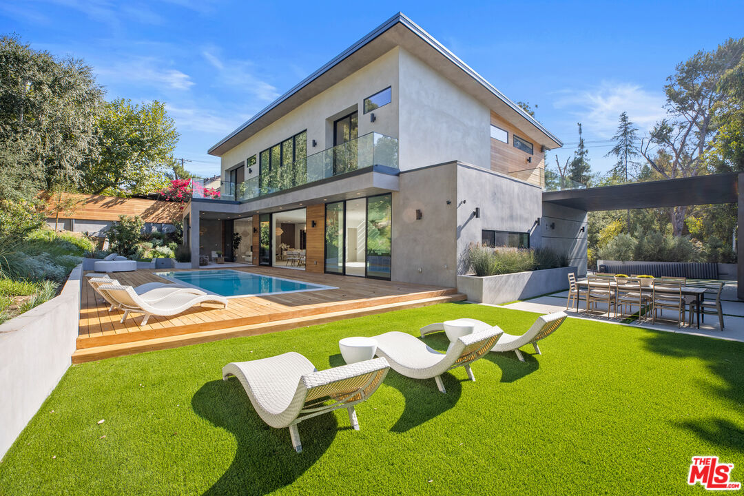 2814 Roscomare Road Los Angeles, CA 90077 - Photo 27 of 35 a view of a house with swimming pool and porch