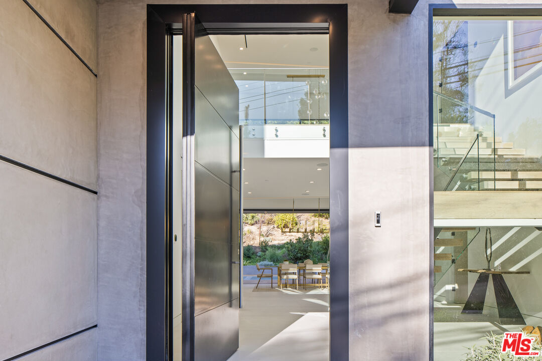 2814 Roscomare Road Los Angeles, CA 90077 - Photo 4 of 35 a picture of a glass door with a glass door