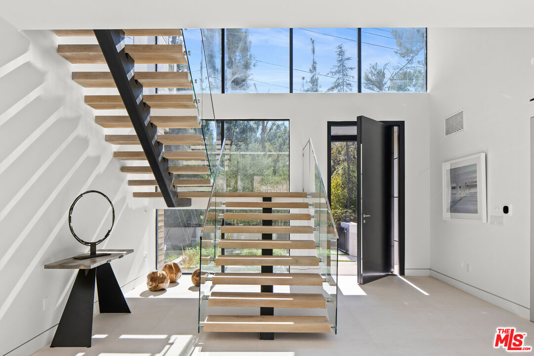 2814 Roscomare Road Los Angeles, CA 90077 - Photo 5 of 35 a view of entryway with workspace and window