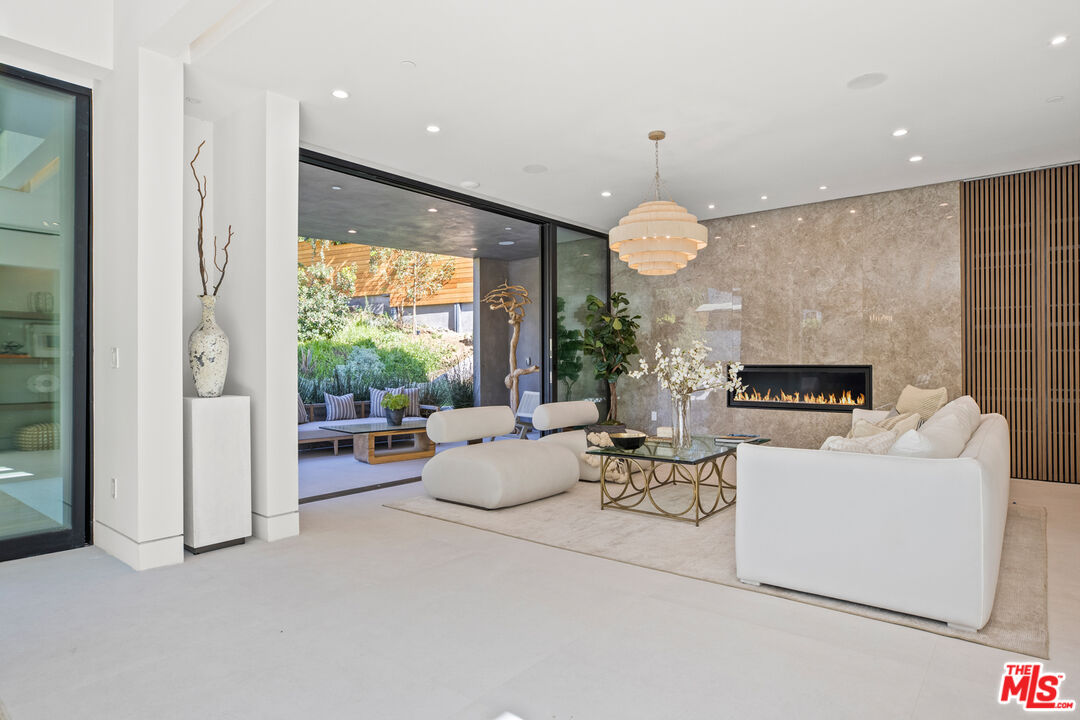 2814 Roscomare Road Los Angeles, CA 90077 - Photo 8 of 35 a living room with furniture and a large window