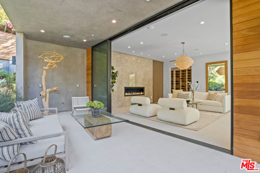 2814 Roscomare Road Los Angeles, CA 90077 - Photo 9 of 35 a living room with furniture and a large window