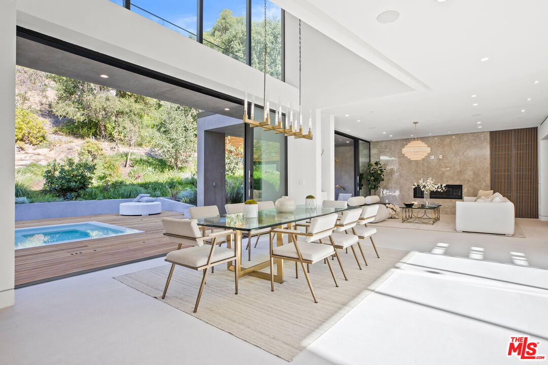 2814 Roscomare Road Los Angeles, CA 90077 - Photo 10 of 35 a view of a patio with a dining table and chairs