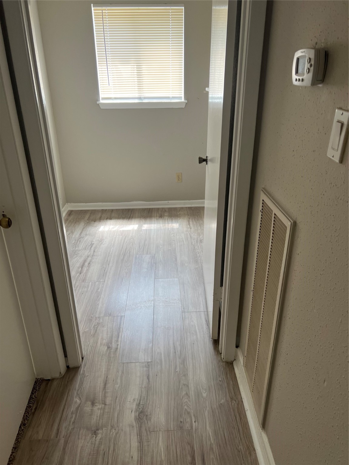 1603 Chestnut Ridge Road Houston, TX 77339 - Photo 12 of 18 a view of a hallway and wooden floor