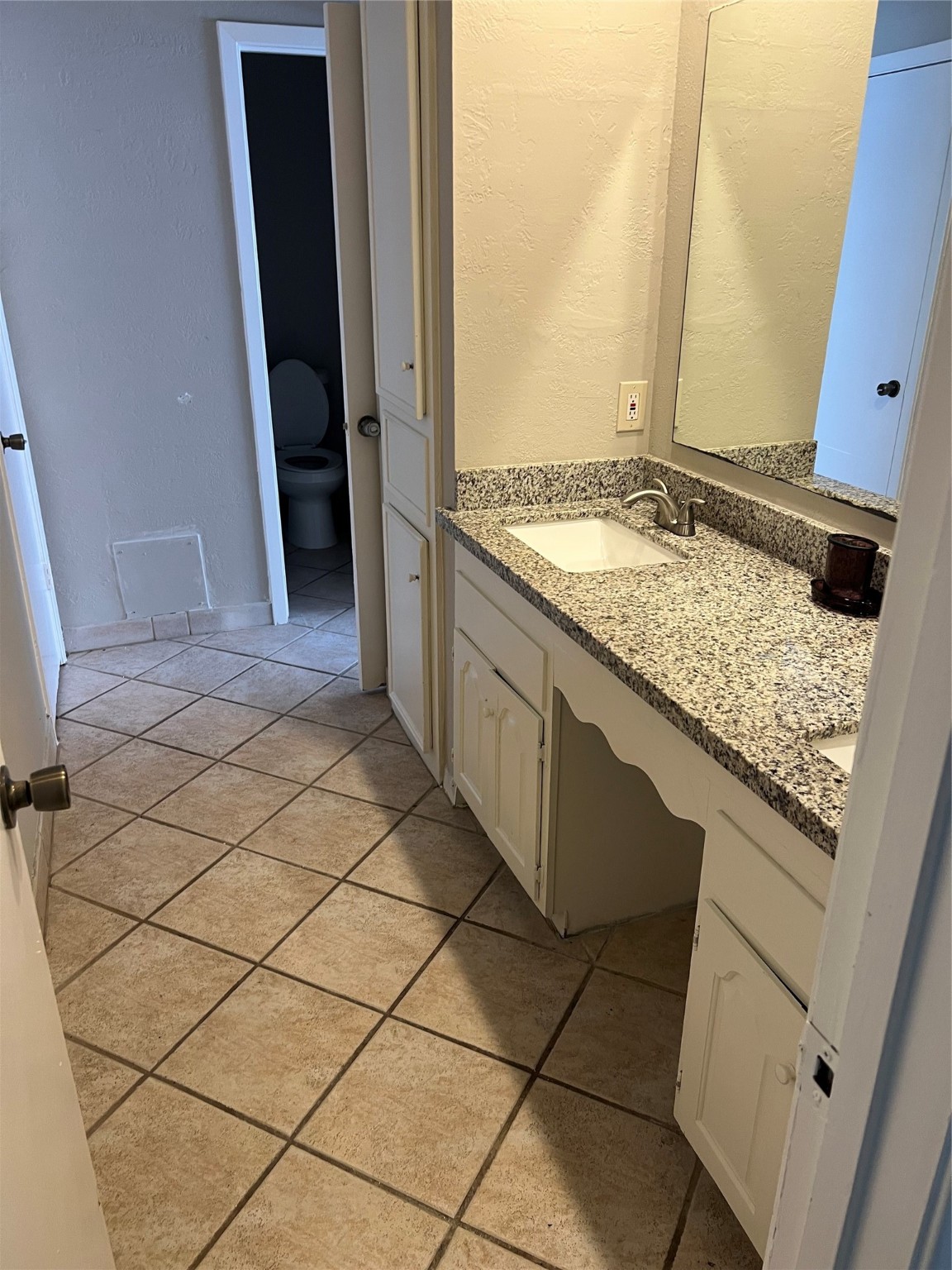 1603 Chestnut Ridge Road Houston, TX 77339 - Photo 13 of 18 a bathroom with a granite countertop sink and a mirror