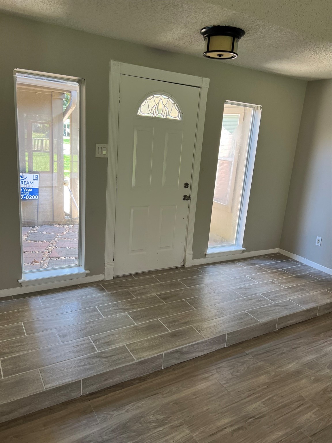 1603 Chestnut Ridge Road Houston, TX 77339 - Photo 14 of 18 a view of an empty room with wooden floor and a window
