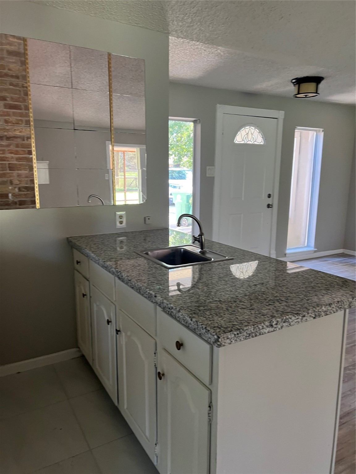 1603 Chestnut Ridge Road Houston, TX 77339 - Photo 18 of 18 a bathroom with a granite countertop sink and a mirror