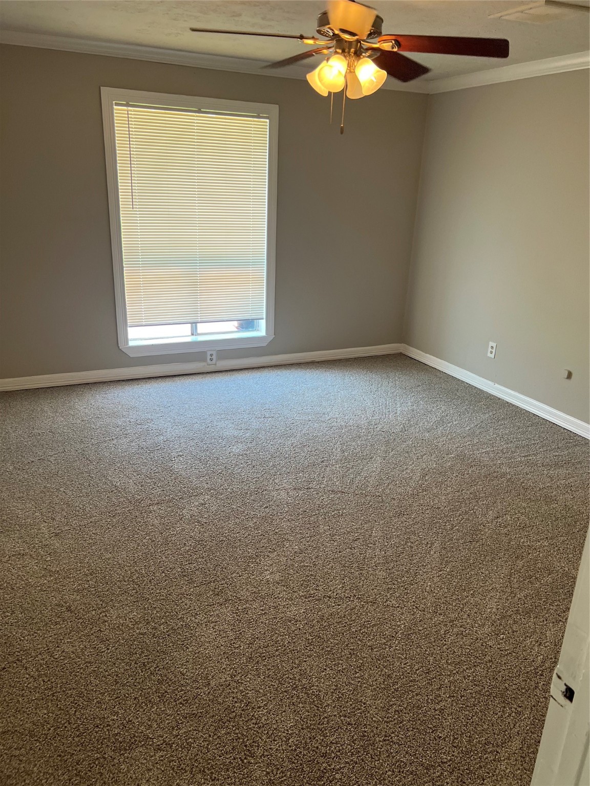 1603 Chestnut Ridge Road Houston, TX 77339 - Photo 9 of 18 a view of an empty room with a window