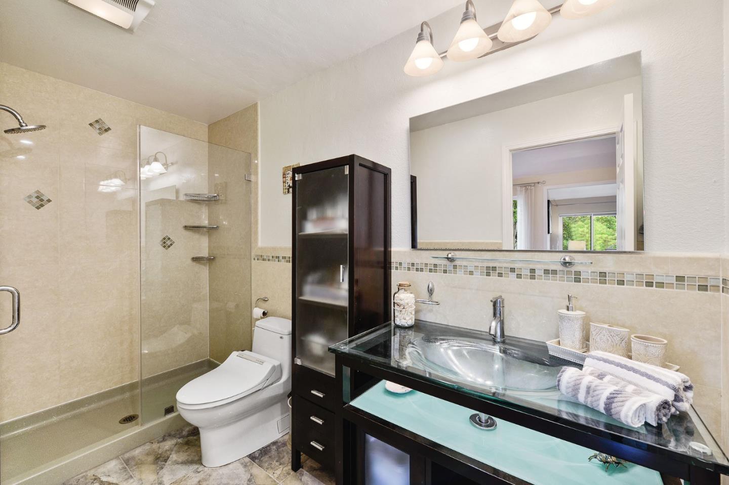 2149 Junction Avenue, Unit 4 Mountain View, CA 94043 - Photo 13 of 20 a bathroom with a granite countertop sink toilet and shower