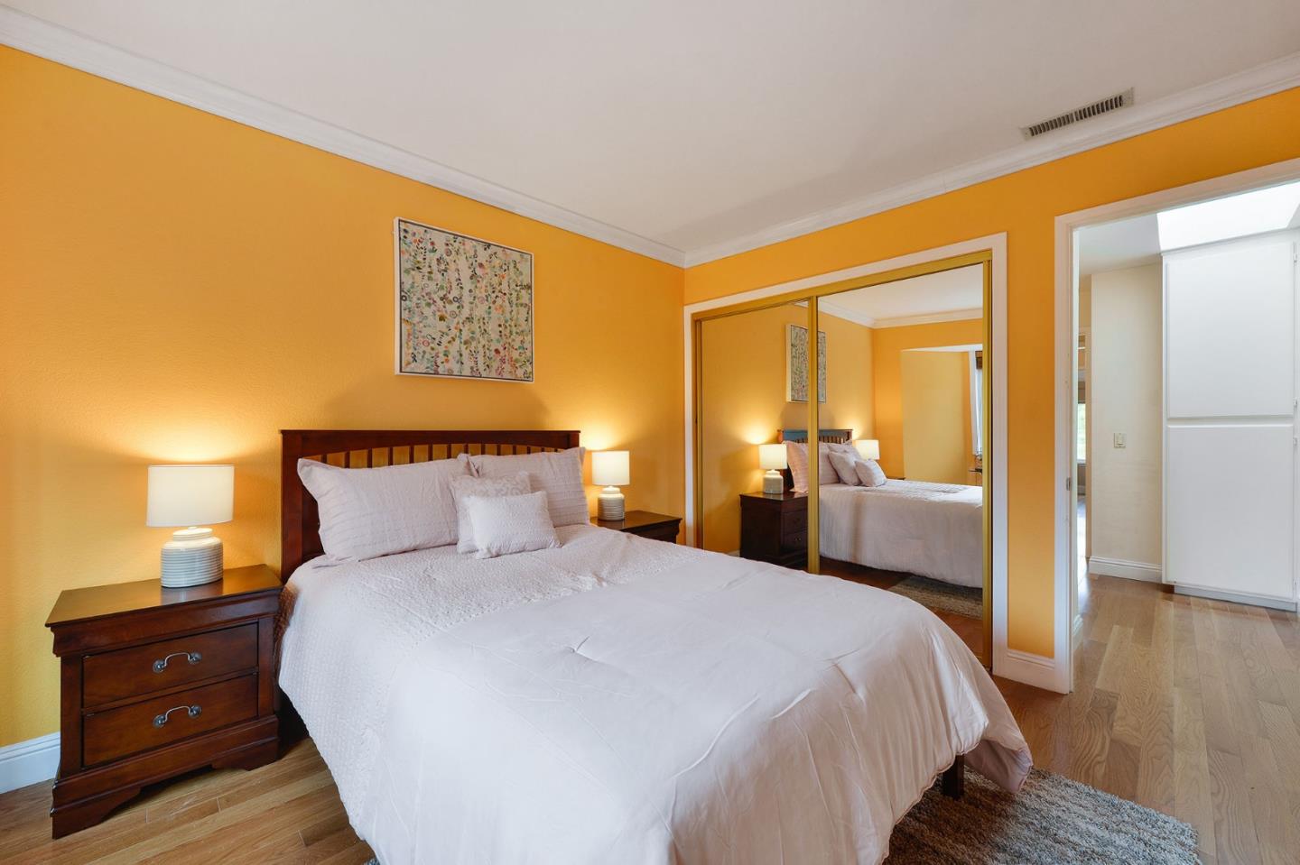 2149 Junction Avenue, Unit 4 Mountain View, CA 94043 - Photo 14 of 20 a bedroom with a bed and wooden floor