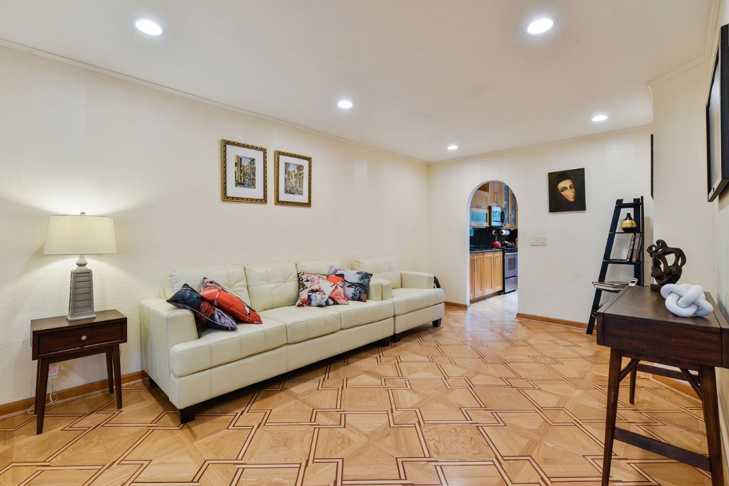 2149 Junction Avenue, Unit 4 Mountain View, CA 94043 - Photo 2 of 20 a living room with furniture and a flat screen tv