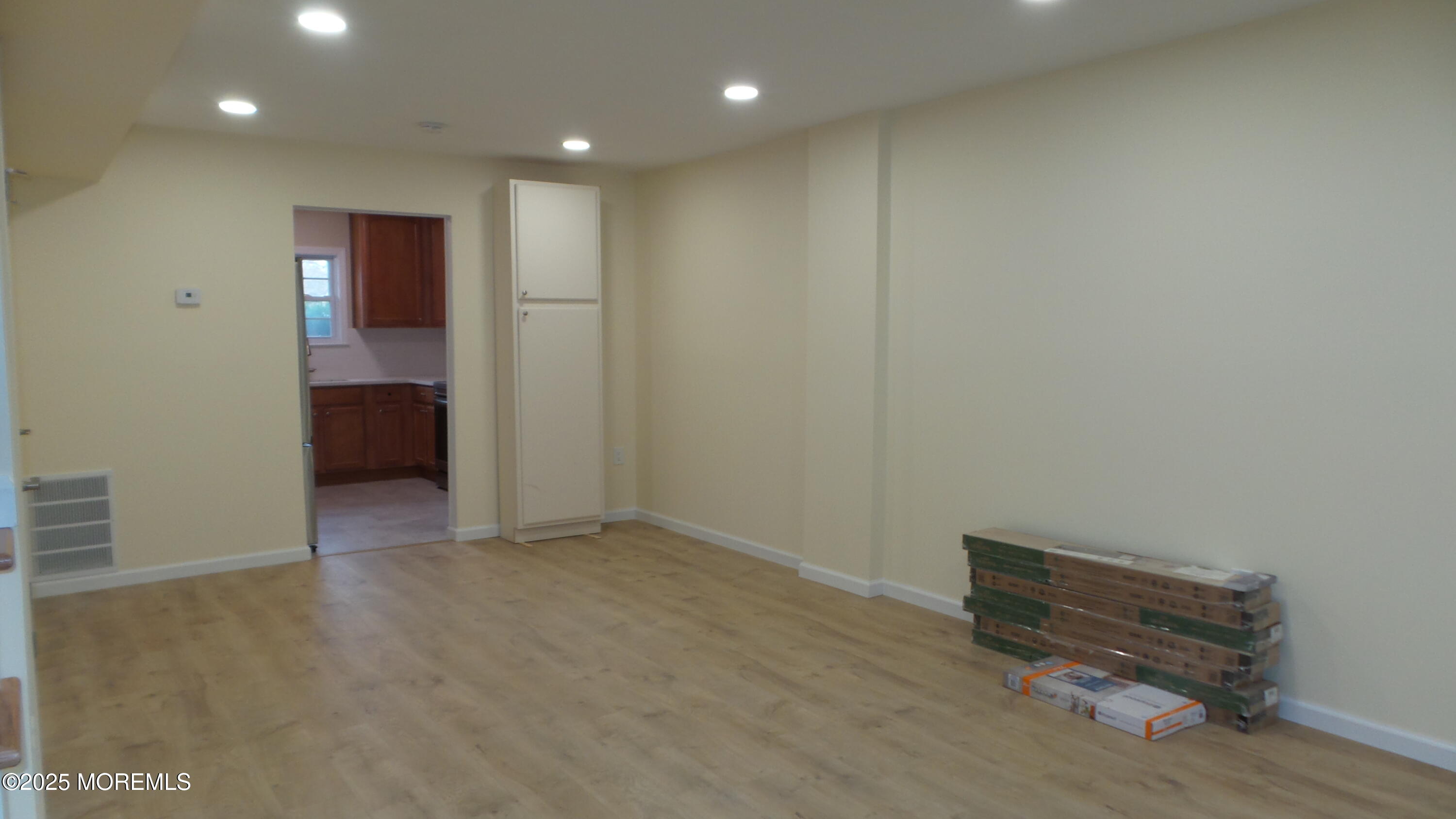 2 Briar Mills Drive Brick, NJ 08724 - Photo 6 of 14 an empty room with wooden floor and windows