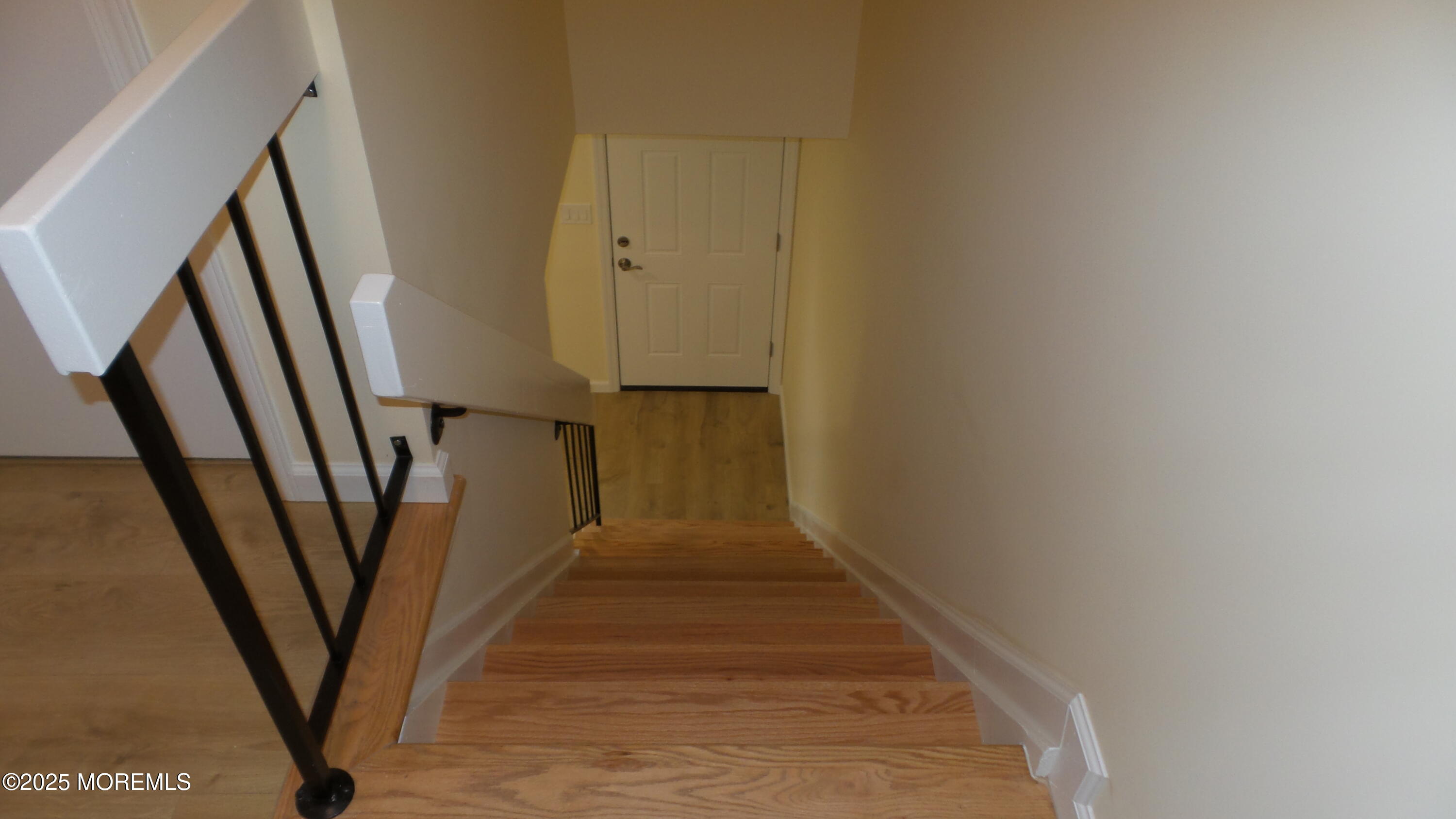 2 Briar Mills Drive Brick, NJ 08724 - Photo 8 of 14 a view of a hallway with wooden floor and stairs