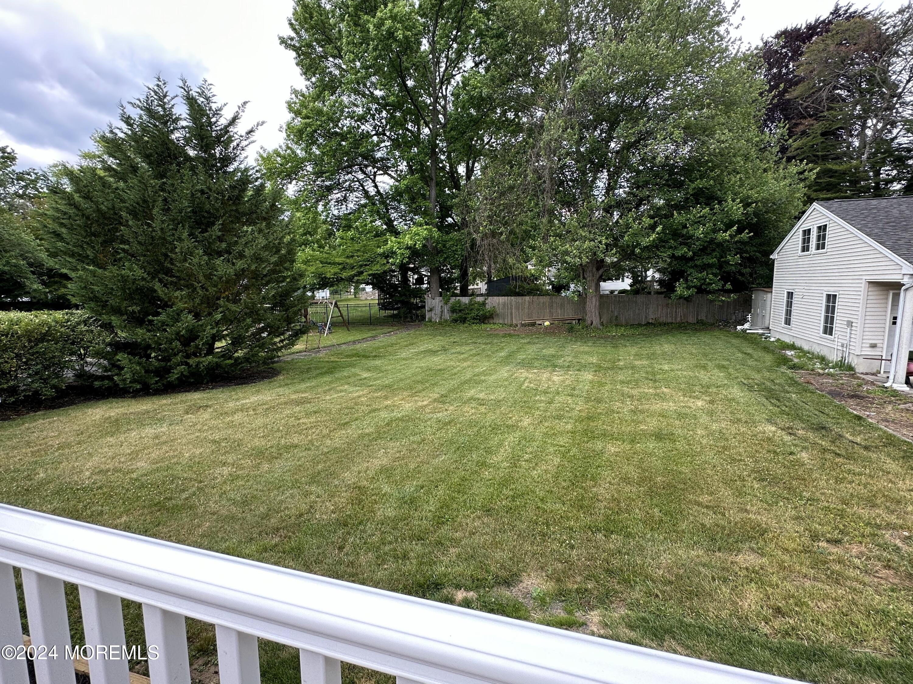 57 Kings Road Little Silver, NJ 07739 - Photo 22 of 22 a view of a yard with plants and trees