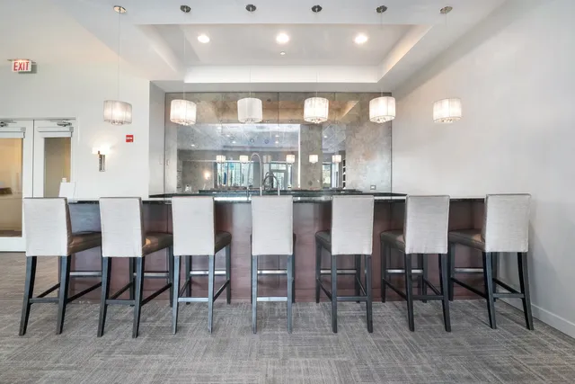 a living room with fireplace furniture and a wooden floor