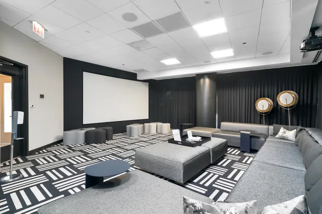 a living room with furniture cabinets and window