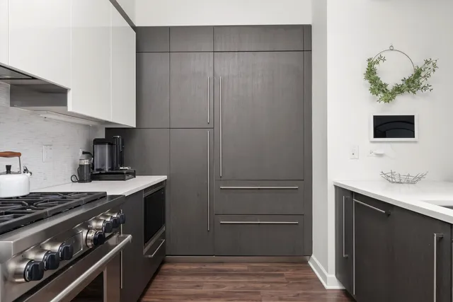 a kitchen with a stove and a refrigerator
