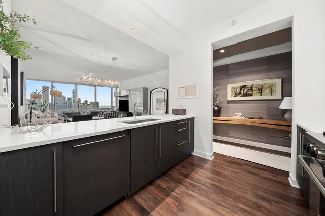 a kitchen with stainless steel appliances sink and cabinets