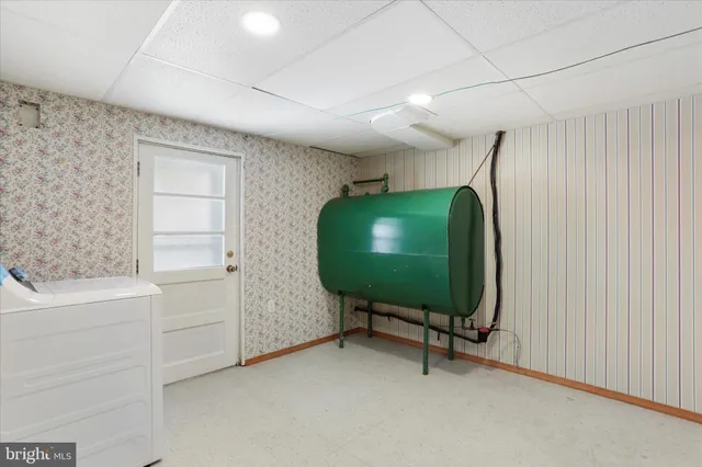 a room with a mirror and furniture