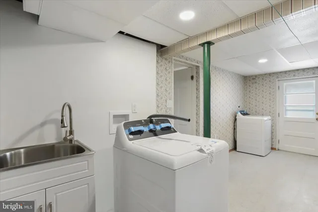 a utility room with dryer and washer