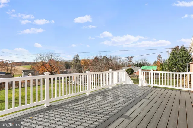 a view of a brick house with large windows