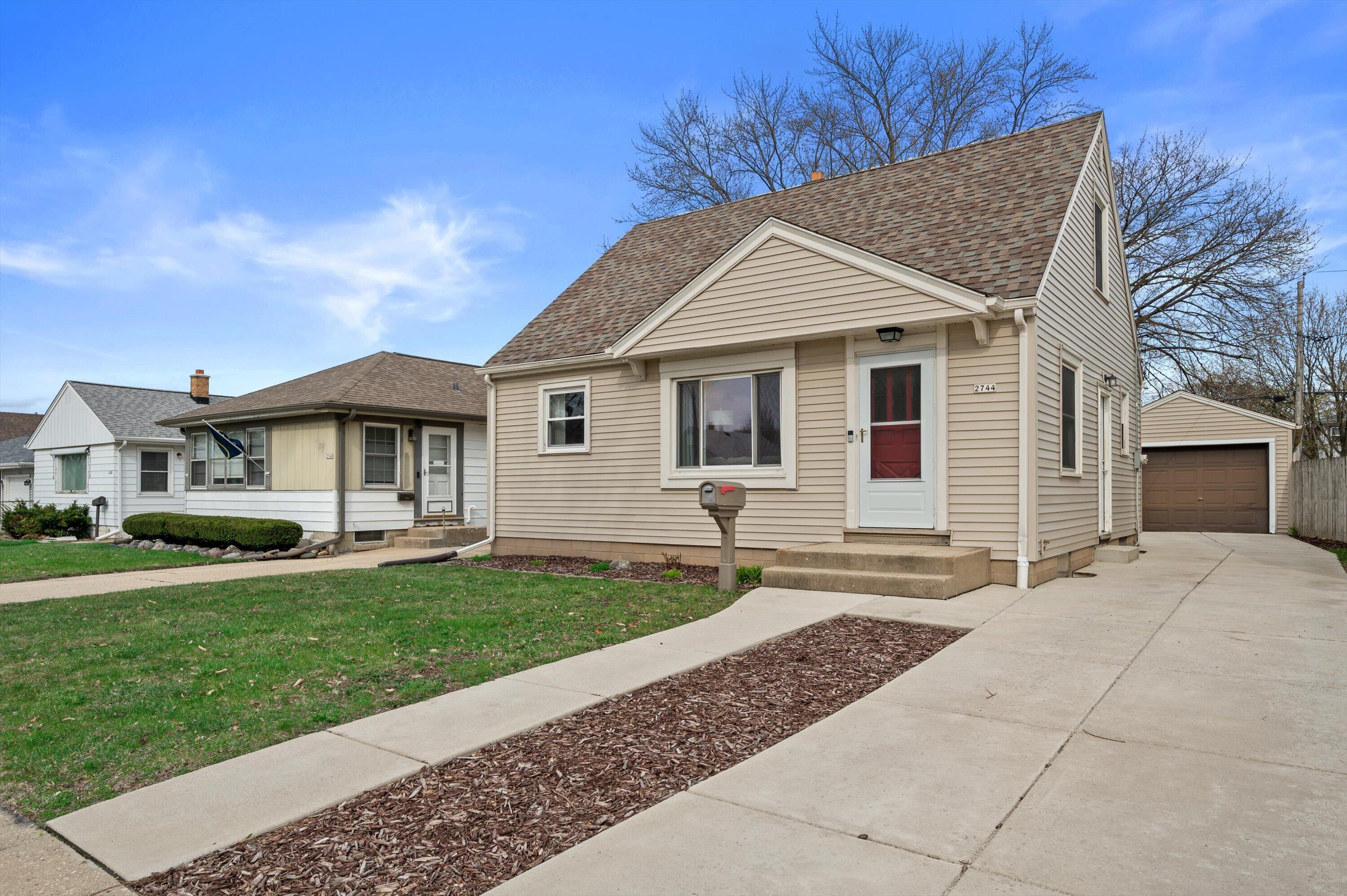 Newer siding, concrete walk and driveway