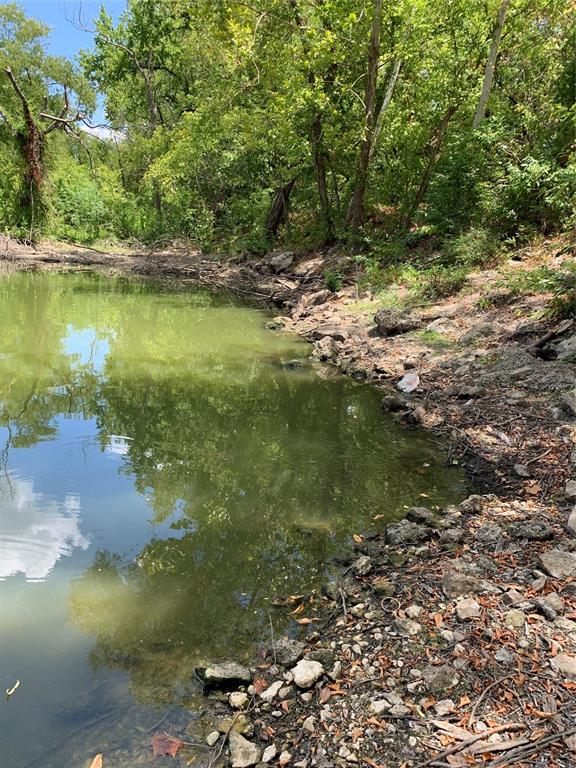 a view of a lake with a yard