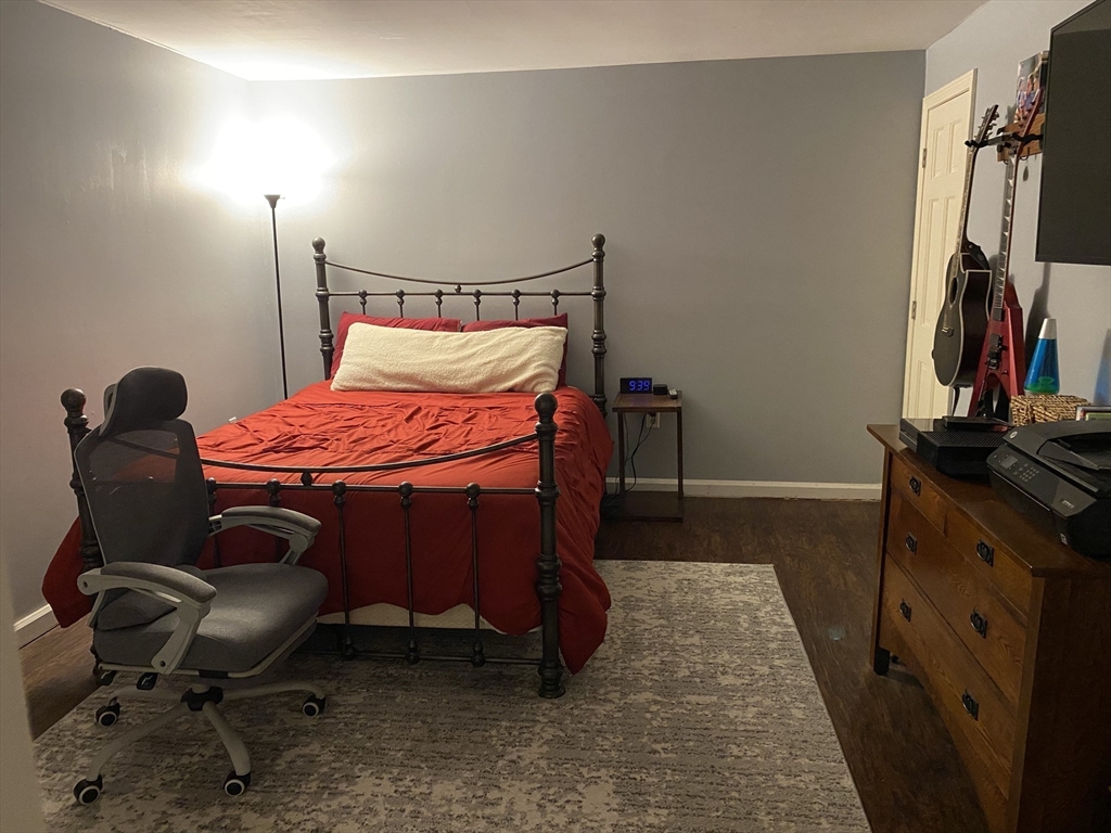 10 Erick Road, Unit 5 Mansfield, MA 02048 - Photo 11 of 24 a bedroom with a bed and a chair in it