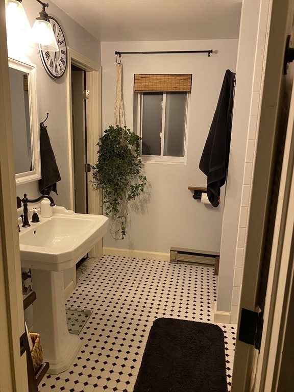 10 Erick Road, Unit 5 Mansfield, MA 02048 - Photo 14 of 24 a bathroom with a sink and mirror