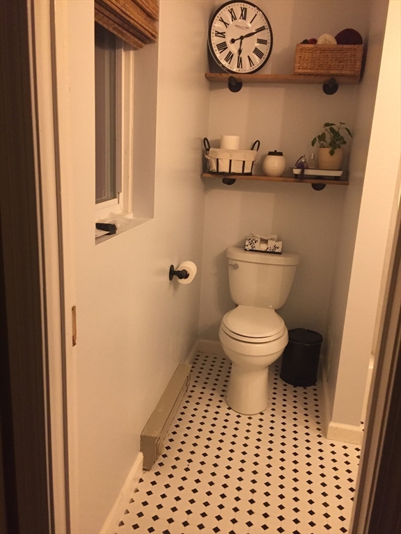 10 Erick Road, Unit 5 Mansfield, MA 02048 - Photo 15 of 24 a bathroom with a toilet and a shower curtain