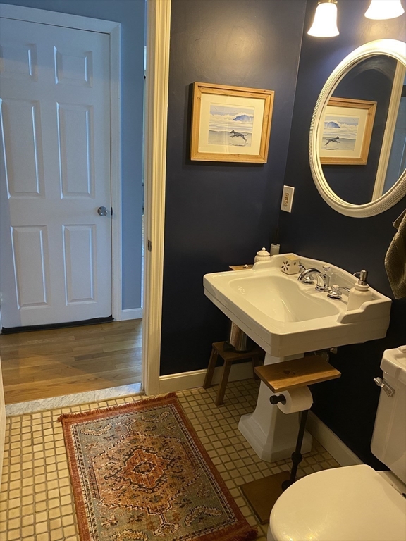 10 Erick Road, Unit 5 Mansfield, MA 02048 - Photo 17 of 24 a bathroom with a sink a mirror and a toilet