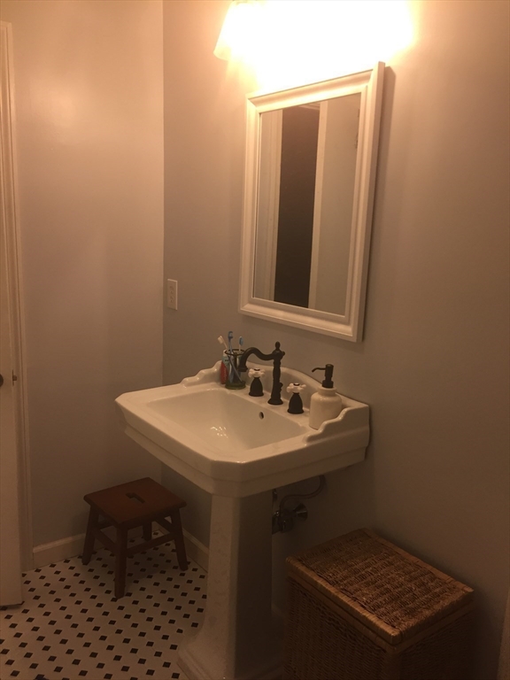 10 Erick Road, Unit 5 Mansfield, MA 02048 - Photo 19 of 24 a bathroom with a sink toilet and mirror