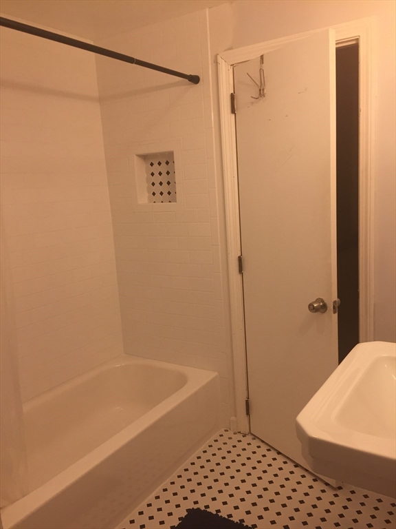 10 Erick Road, Unit 5 Mansfield, MA 02048 - Photo 20 of 24 a bathroom with a shower and a toilet