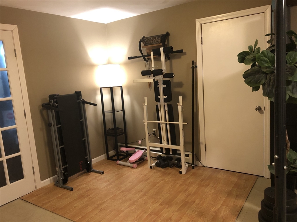 10 Erick Road, Unit 5 Mansfield, MA 02048 - Photo 23 of 24 a view of a room with gym equipment