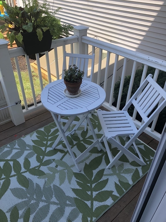 10 Erick Road, Unit 5 Mansfield, MA 02048 - Photo 5 of 24 a view of balcony with table and chairs