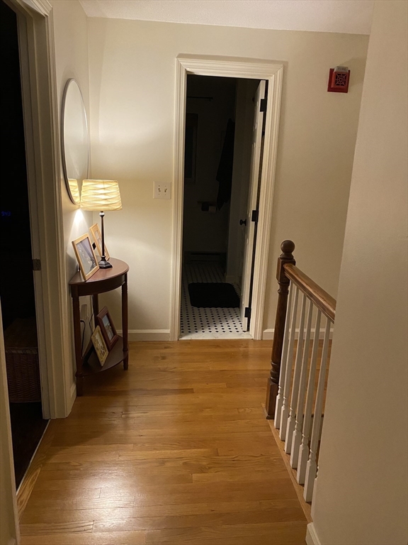 10 Erick Road, Unit 5 Mansfield, MA 02048 - Photo 10 of 24 a view of a hallway with wooden floor and staircase
