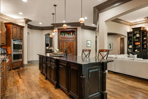 a living room with furniture large window and flat screen tv