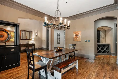 a kitchen with stainless steel appliances granite countertop a stove a sink dishwasher and cabinets with wooden floor