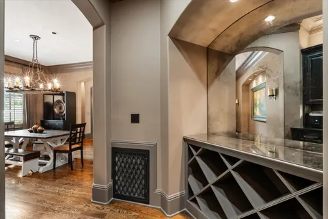 a kitchen with stainless steel appliances granite countertop a sink a stove and a wooden floors