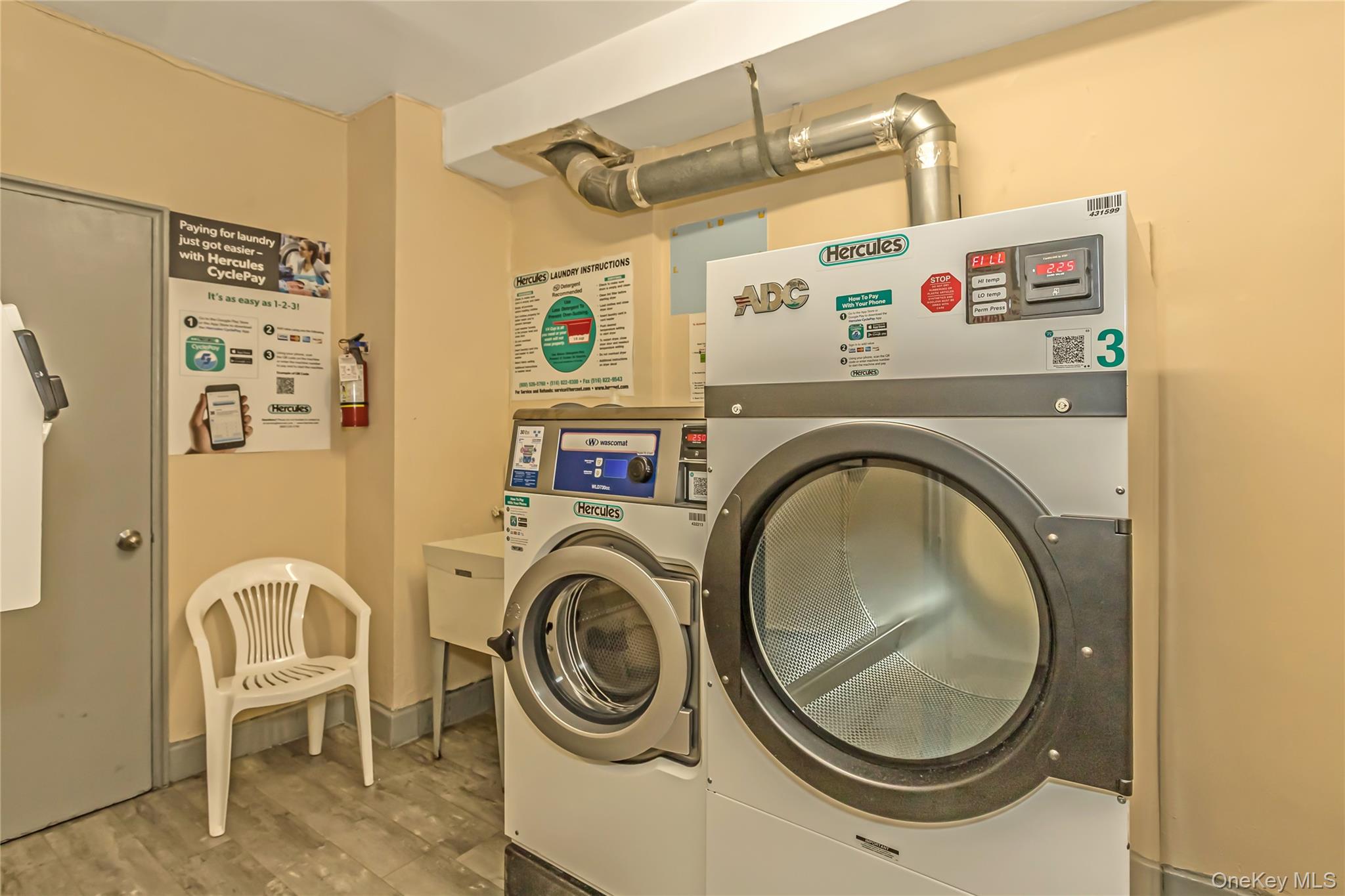 250 West Merrick Road, Unit 2L Freeport, NY 11520 - Photo 17 of 17 a utility room with dryer and washer
