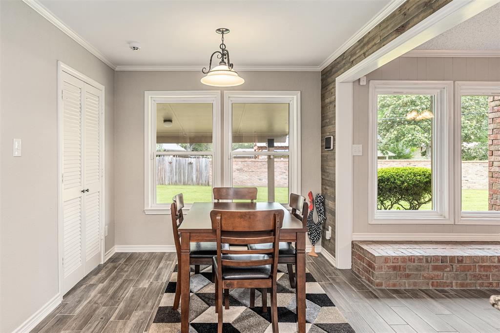1102 Mill Run Road Athens, TX 75751 - Photo 12 of 35 a dining room with furniture a chandelier and wooden floor