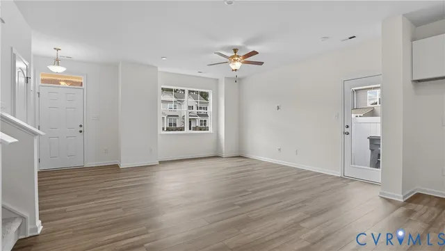 wooden floor in an empty room with a window