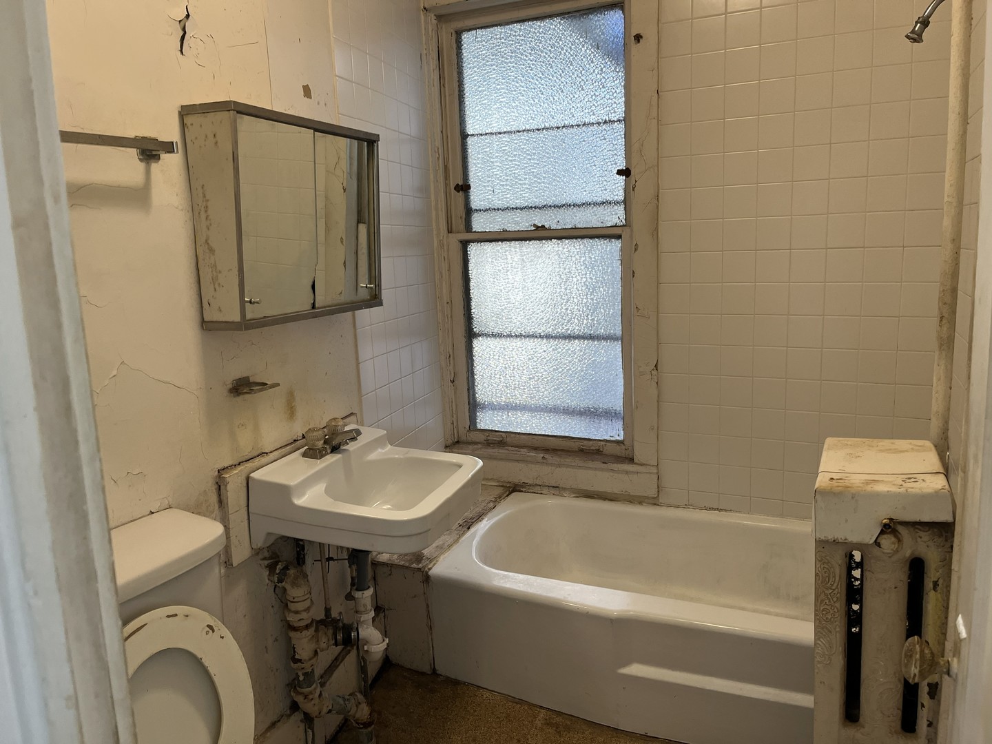 518 Hamilton Street Evanston, IL 60202 - Photo 5 of 15 a bathroom with a sink a toilet and shower