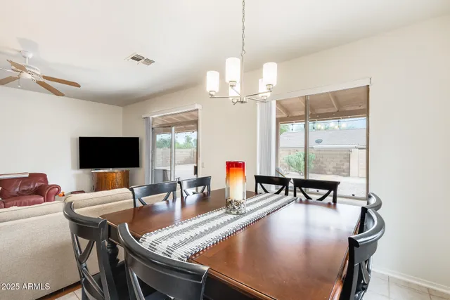 a living room with lots of furniture and a table