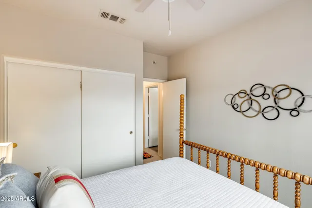 a bedroom with a bed and a window