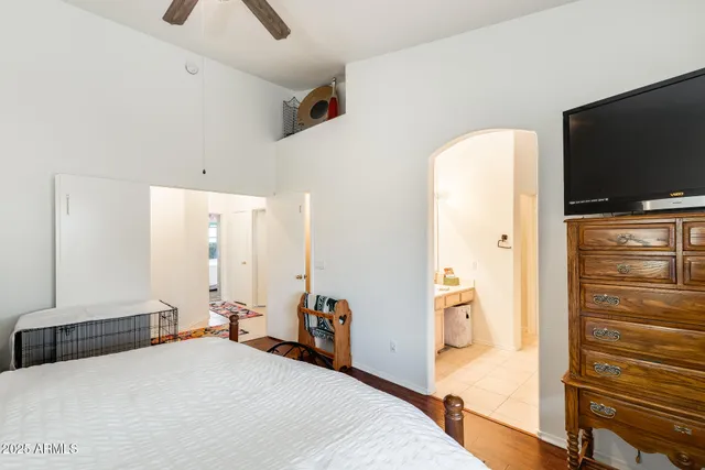 a bathroom with a double vanity sink a toilet and a mirror
