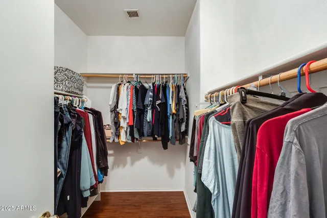 a bedroom with two beds and a window