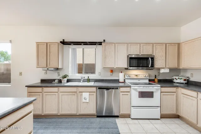 a living room with fireplace furniture and a flat screen tv