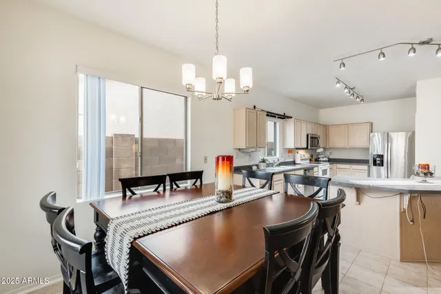 a kitchen with white cabinets sink and white appliances