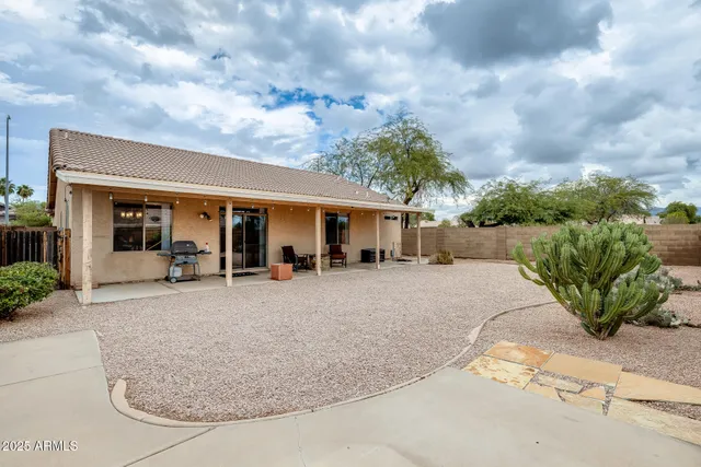 a very nice looking dining room with a large dining table and chairs