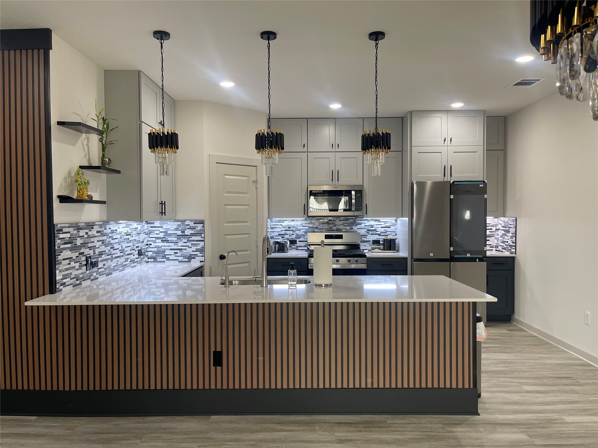 145 Merrick Road Georgetown, TX 78628 - Photo 11 of 32 Modern cabinetry and a spacious breakfast bar complete this stylishly updated kitchen.